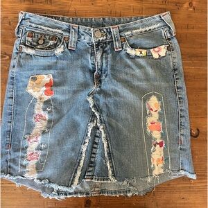 True Religion Denim Skirt.  Fringed edges with cut outs and patch work. WAIST 31